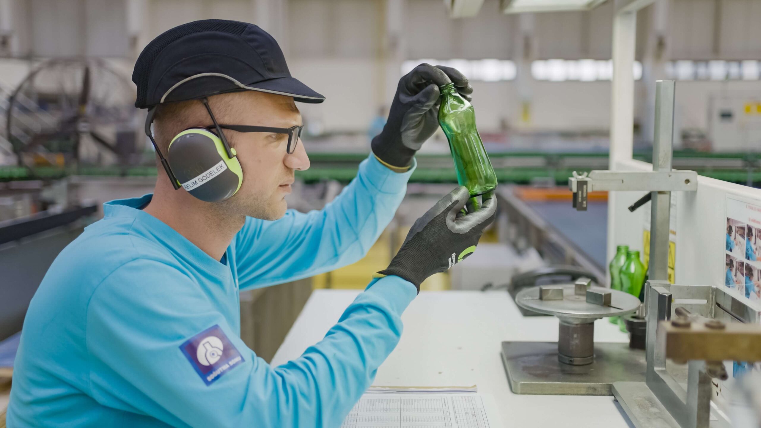 Man checking glass quality